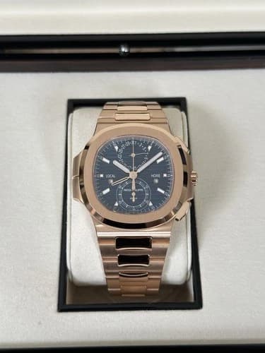 Patek Philippe Nautilus 5990 Travel Time Chronograph — 5990/1A